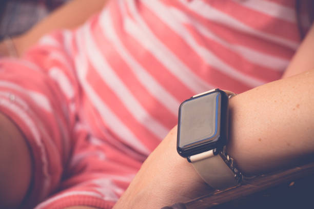 istock Smartwatch on sitting young woman hand 1215313727