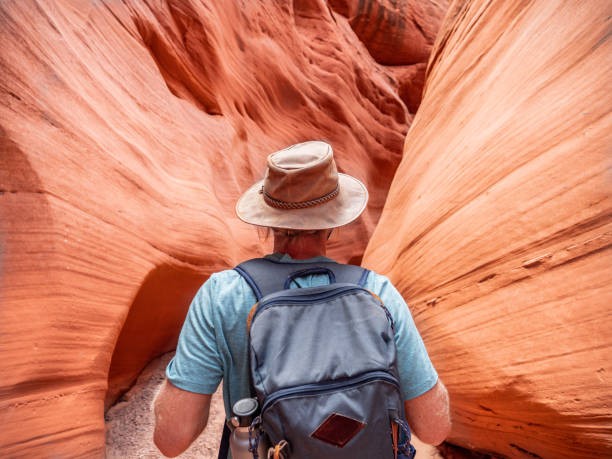 istock Young man walking inside Antelope Canyon, USA 1215316902