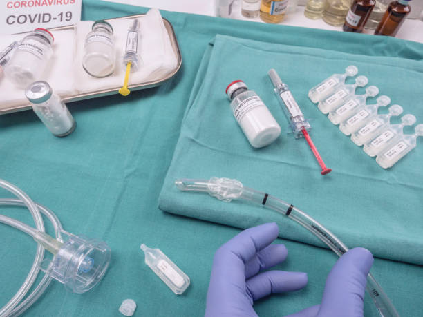 istock Nurse refilling medication solution nebulizer container, along with medical treatment with Dexamethasone and heparin in the hospital 1215319976