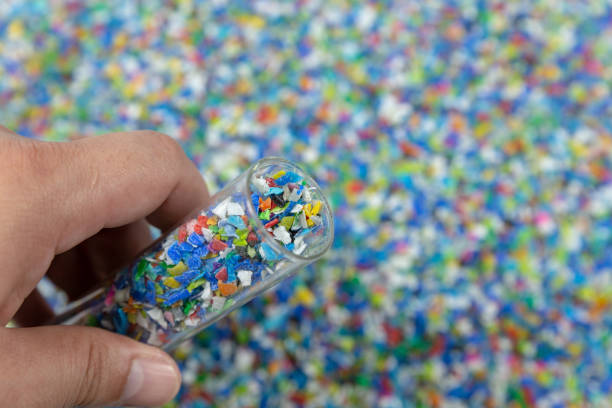 istock Close-up of plastic polymer granules. hand hold Polymer pellets. polymer plastic. compound polymer. 1215320131