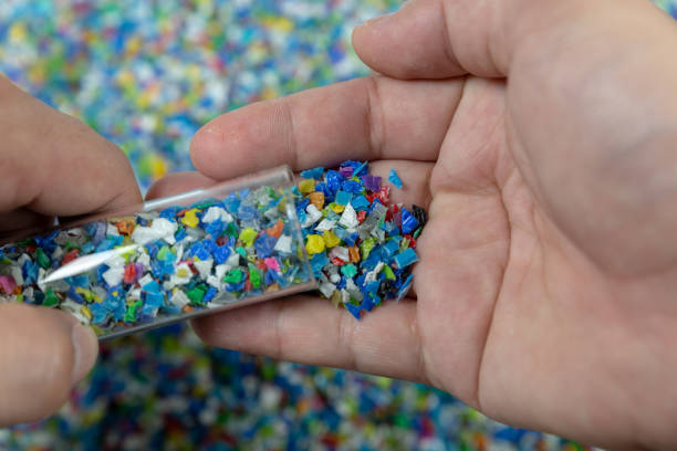 istock Close-up of plastic polymer granules. hand hold Polymer pellets. polymer plastic. compound polymer. 1215320162
