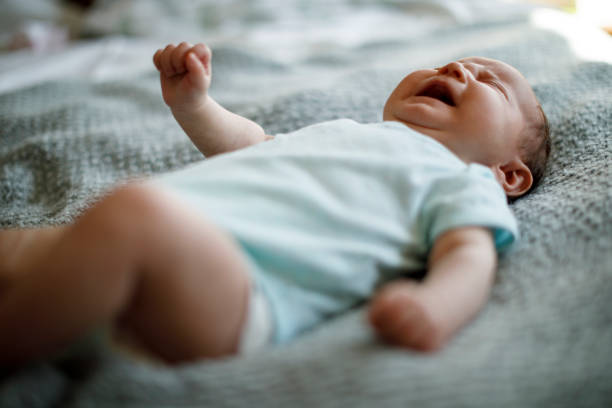 istock Newborn baby girl crying 1215320174