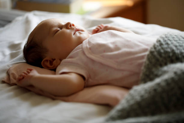istock Cute little baby sleeping at home 1215320345