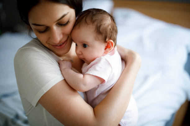 istock Mother and baby at home 1215320523