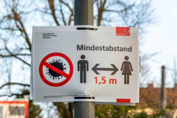 Sign in German about keeping a minimum of 1.5m distance due to the Corona Virus NUERNBERG, GERMANY - March 27, 2020: Sign in German about keeping a minimum of 1.5m distance due to the Corona Virus franconia photos stock pictures, royalty-free photos & images