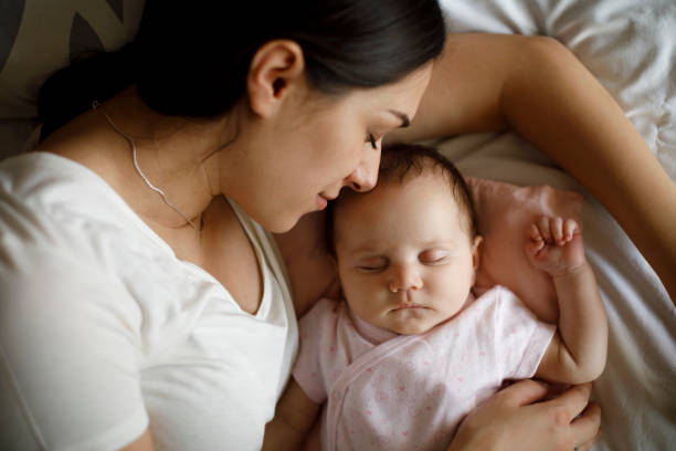 istock Mother and baby sleeping 1215320663