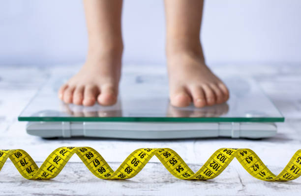 istock Child measuring weight concept. Close up 1215324665