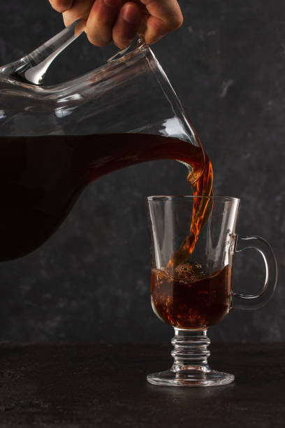 istock Cold brewing coffs poured from carafe into a glass 1215326351