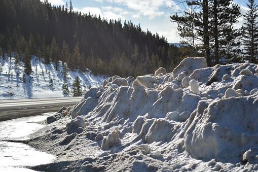 Snow Bank on Road Side from Winter Road Clearing in the Rocky Mountains