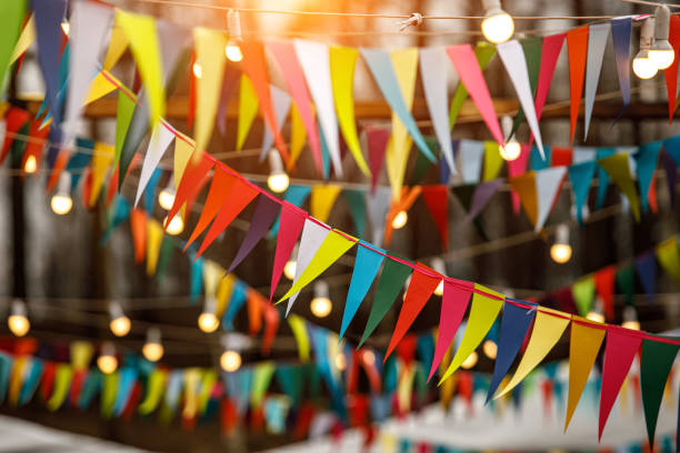 istock Background from holiday flags. Many colored flags and lanterns 1215328612
