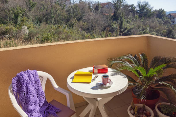istock Spending time at home. Books and cup of coffee 1215329635