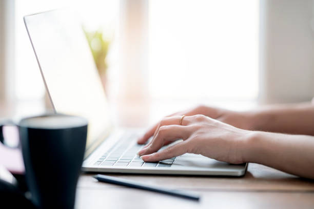 istock Woman hand typing on laptop keyboard, closeup view. 1215329727