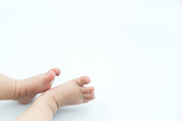 istock Cute baby feet on white background 1215330597