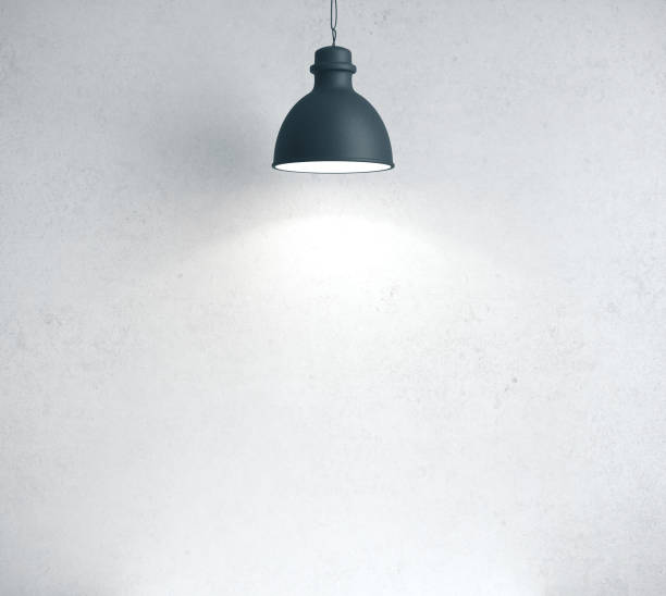 istock Concrete room with blank wall and lamp. 1215331990