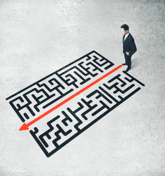 istock Businessman looking on red arrow 1215332044