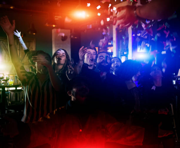 Young people dancing and having fun in night club