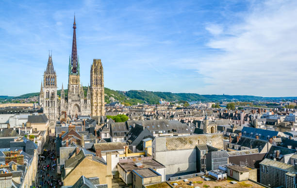 Panoramic view of Rouen, with the gothic Cathedral of Notre-Dame, on a sunny afternoon. Normandy, France. Panoramic view of Rouen, with the gothic Cathedral of Notre-Dame, on a sunny afternoon. Normandy, France. rue du gros horloge photos stock pictures, royalty-free photos & images