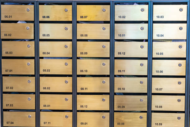 istock Metallic letter mailboxes at postal room in condominium building 1215338994