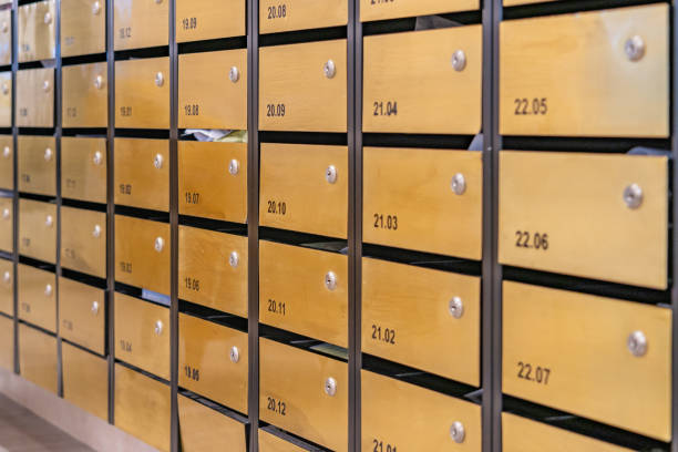 istock Letter mailbox array at entrance hall lobby of condominium building 1215339089