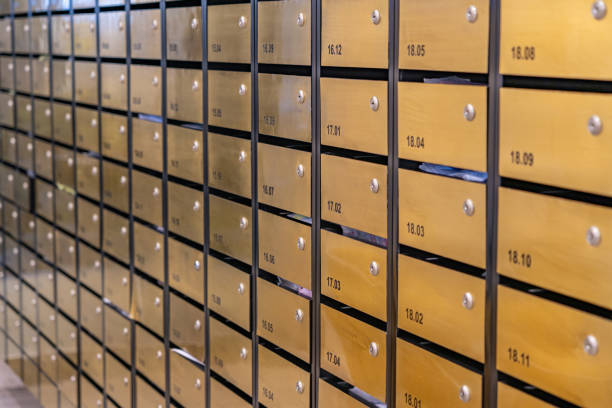 istock Metallic mailbox rows at postal room inside condominium building 1215339179