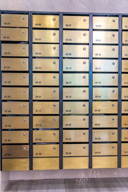 istock Metallic mailbox array in lobby of condominium building 1215339208