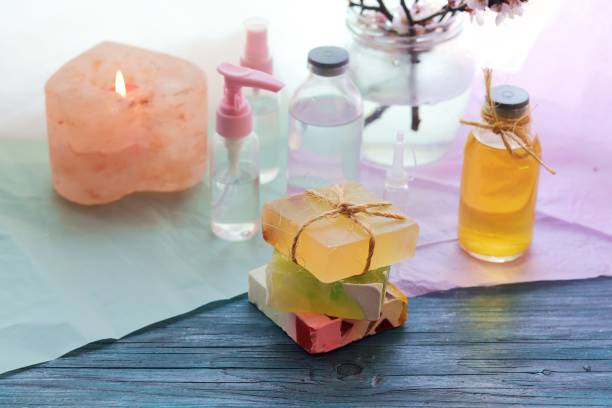 istock Soap, antiseptic liquid, aroma lamp with a lit candle on the windowsill 1215343703