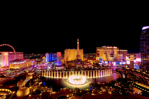 Las Vegas, Nevada, USA - October 31, 2019: Night view of Las Vegas Bellagio Hotel and Casino fountain and other hotels on Strip (View from Bellagio Hotel)