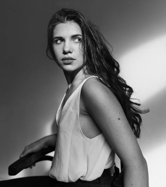 istock Young beautiful woman posing in studio 1215344949