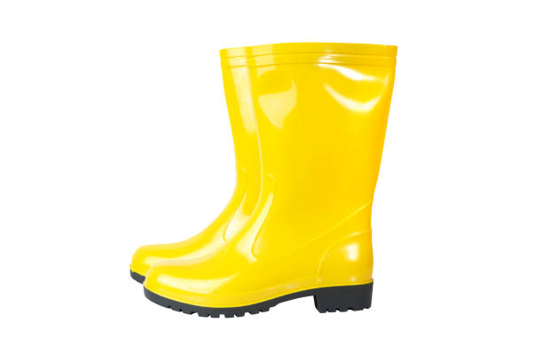 istock Yellow rain boots isolated on white background 1215345975