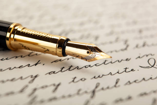 istock fountain pen on paper with ink text on the paper closeup 1215347258