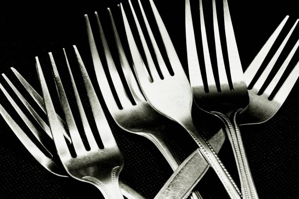 istock Closed up part of forks - black background. 1215347850