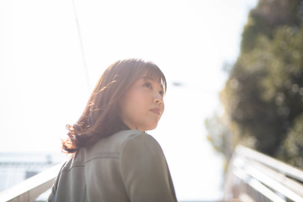 istock Profile view of woman from low angle 1215347901