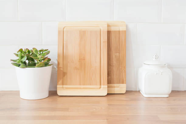 istock Bright And Clean Modern Minimalist Kitchen, Close Up. Cutting Boards, Green Succulent Pot On A Wooden Worktop 1215351626