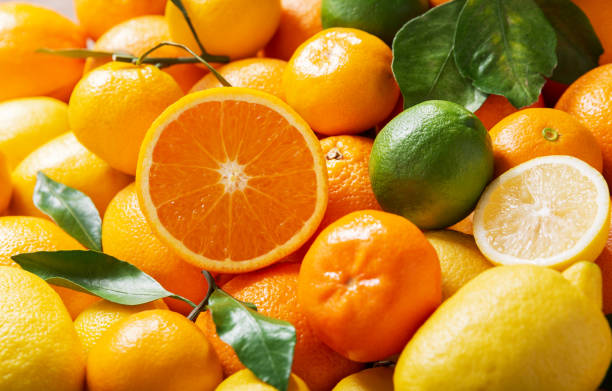 istock fresh citrus fruits with leaves as background 1215352591
