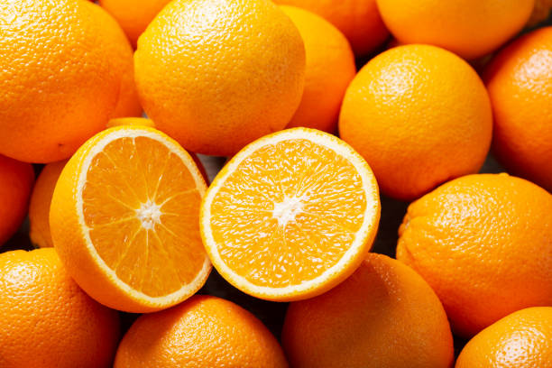 istock fresh orange fruits as background 1215353138