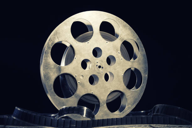 istock 35 mm film reel with dramatic lighting on a dark background 1215353418