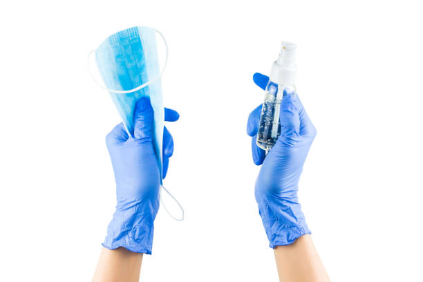istock Protective medical mask in hand, isolated on white 1215353469
