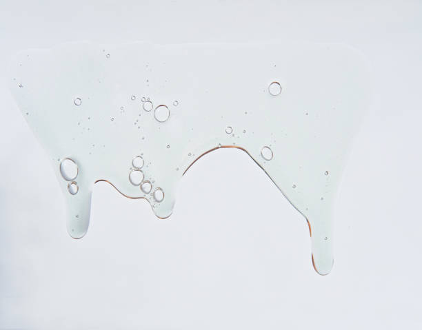 istock Collagen peptides Serum texture. Clear cosmetic liquid gel on white background. 1215354670