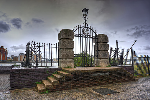 Deptford, London, United Kingdom - October 12, 2019: Gates and steps leading to the river Thames