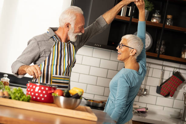 istock Senior couple dance in their kitchen. 1215354781