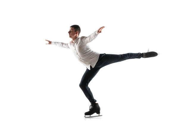 istock Man figure skating isolated on white studio backgound with copyspace 1215355260