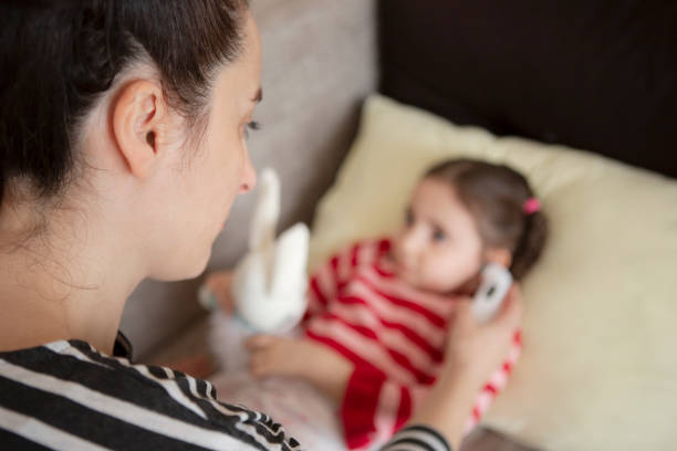 istock Measure Temperature On Sick Child 1215355353