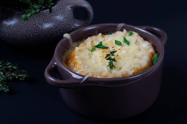 istock French onion soup in a little ceramic pot against the dark background 1215356521