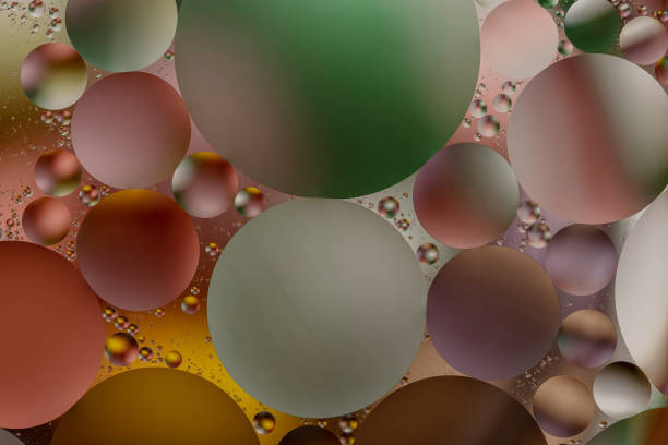 istock Colorful backdrop with oil drops on water surface. Abstract background. 1215356565