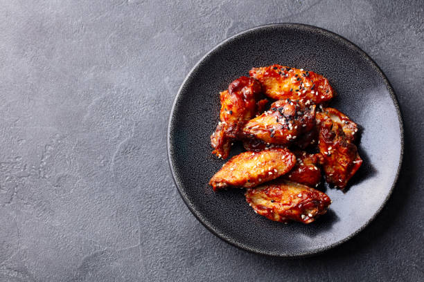 chicken wings. traditional asian recipe. dark background. copy space. top view. - chicken wing white meat unhealthy eating plate imagens e fotografias de stock