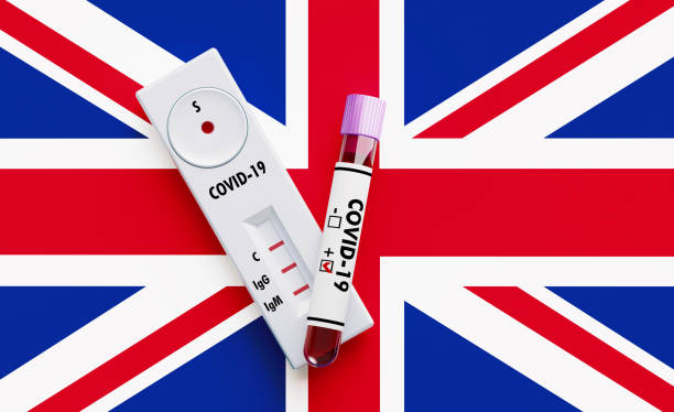 istock COVID-19 Test Tube and Test Kit Sitting on British Flag 1215360812