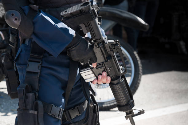 istock Soldier holding a machine with automatic gun.Preparation for military action 1215363232