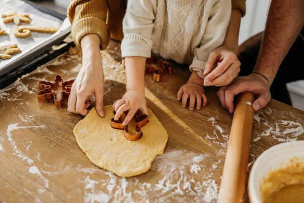 istock Young family baking cookies 1215364132