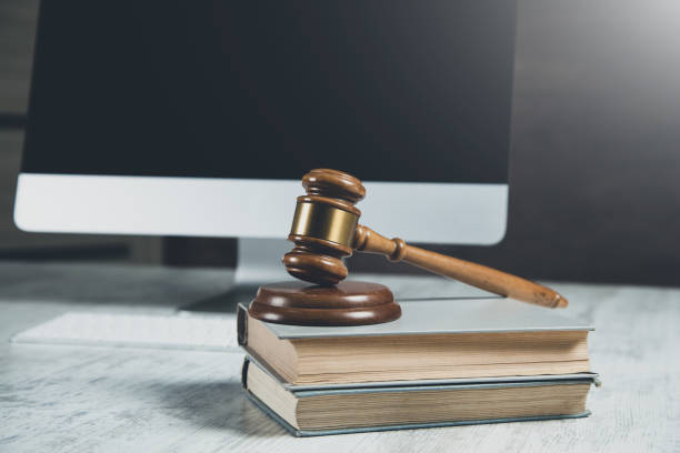 istock wooden judge on book on computer background 1215364245