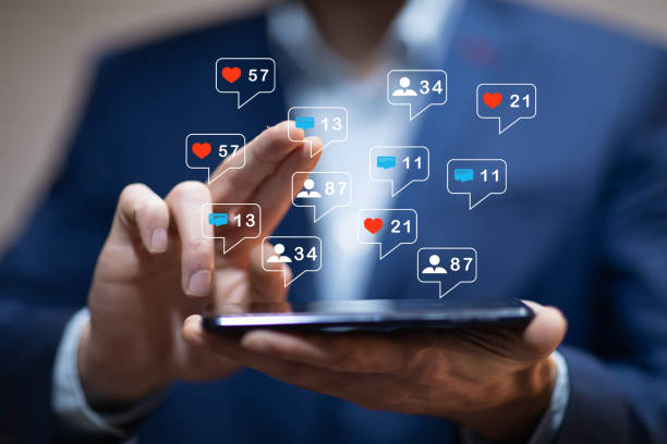 istock man hand using smartphone with colorful application icons around 1215364302